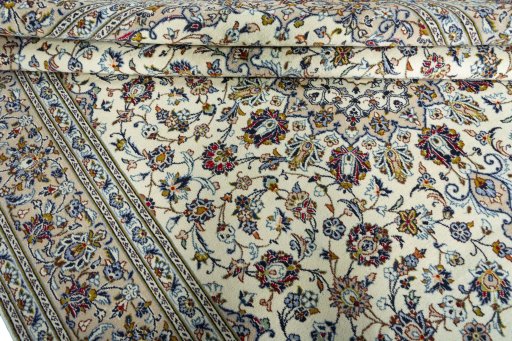 Close-up detail of 2000s Kashan rug from Iran / Persia showing Wool weave