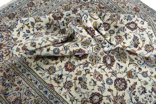 Surface texture of 2000s Kashan rug with natural Wool and intricate pattern