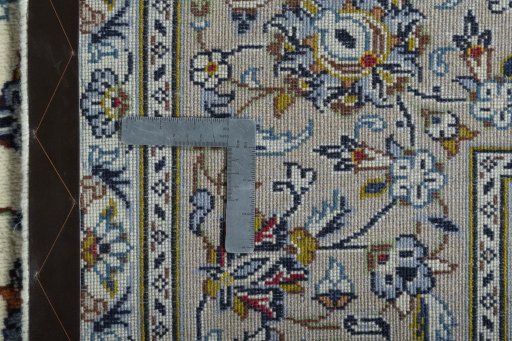 Backside of handmade 2000s Kashan rug showing knot structure and weave density