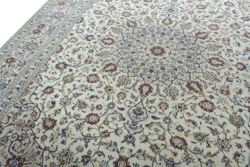 Backside of handmade 2000s Kashan rug showing knot structure and weave density