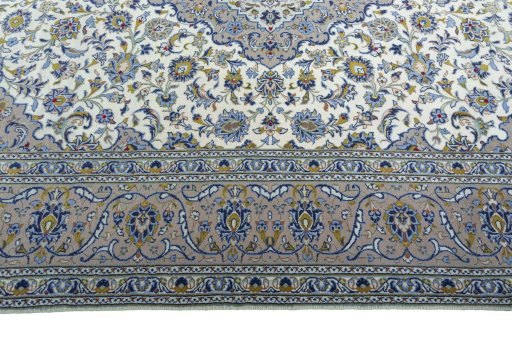 Corner detail of 2000s Kashan rug showing border pattern and Wool pile
