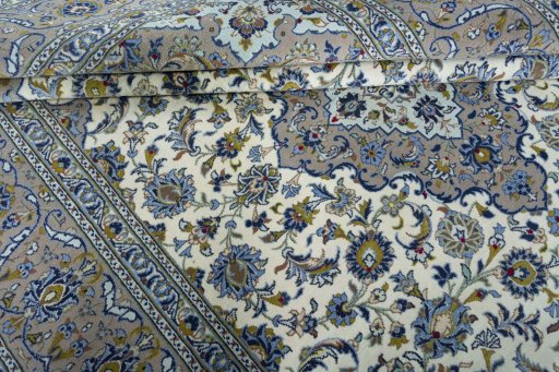 Close-up detail of 2000s Kashan rug from Iran / Persia showing Wool weave