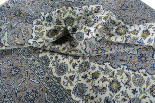 Surface texture of 2000s Kashan rug with natural Wool and intricate pattern