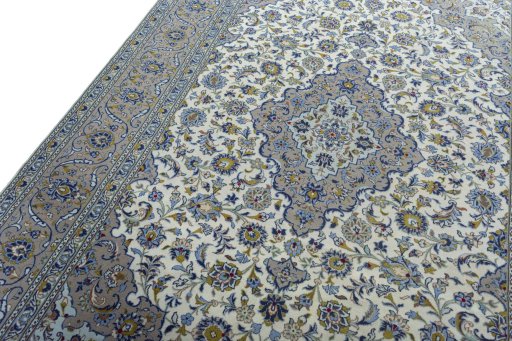 Backside of handmade 2000s Kashan rug showing knot structure and weave density