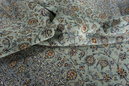 Surface texture of 2000s Kashan rug with natural Wool and intricate pattern