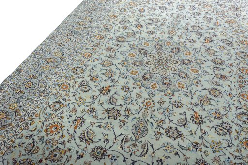 Backside of handmade 2000s Kashan rug showing knot structure and weave density