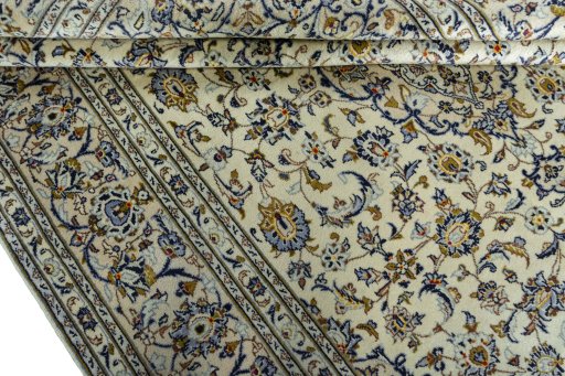 Close-up detail of 2000s Kashan rug from Iran / Persia showing Wool weave