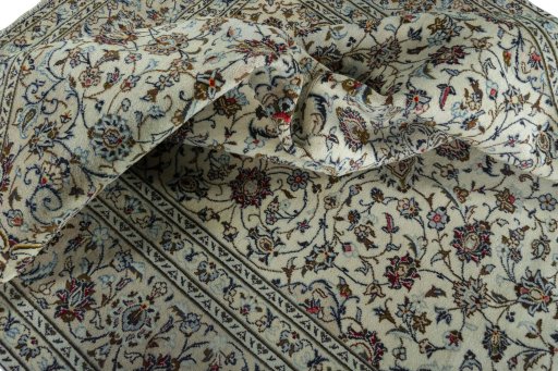 Surface texture of 2000s Kashan rug with natural Wool and intricate pattern