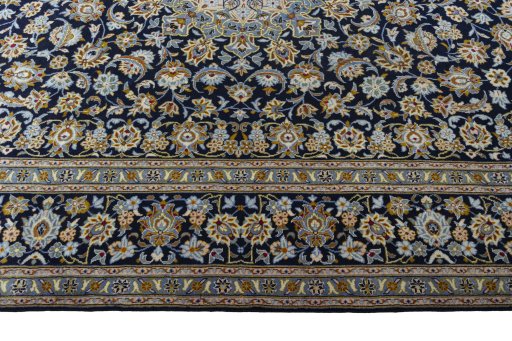 Corner detail of 2000s Kashan rug showing border pattern and Wool pile