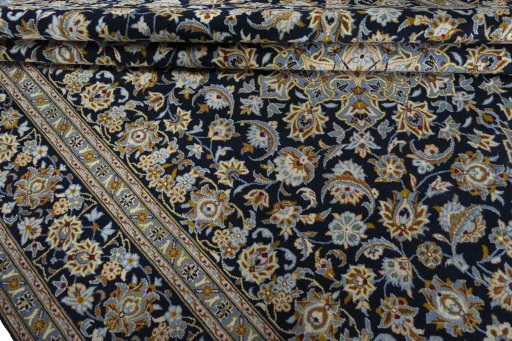 Close-up detail of 2000s Kashan rug from Iran / Persia showing Wool weave