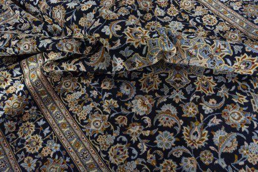 Surface texture of 2000s Kashan rug with natural Wool and intricate pattern
