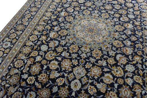 Backside of handmade 2000s Kashan rug showing knot structure and weave density