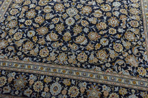 Close-up detail of 2000s Kashan rug from Iran / Persia showing Wool weave