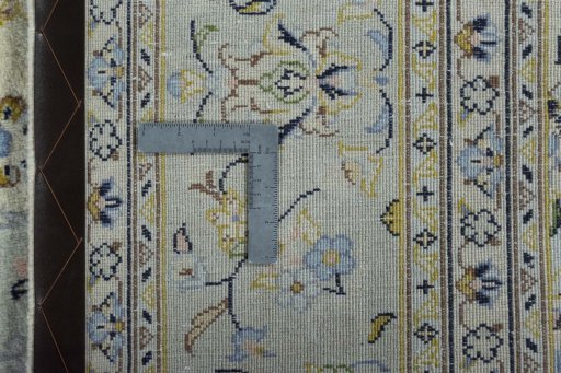 Backside of handmade 2000s Kashan rug showing knot structure and weave density