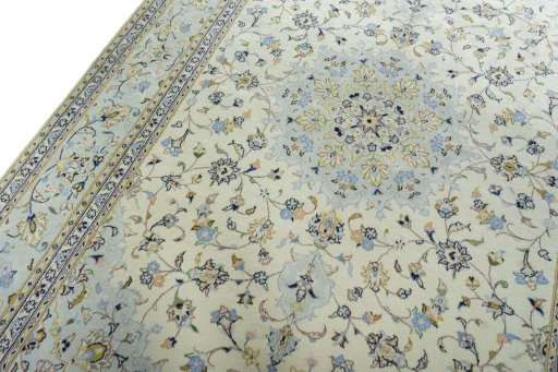 Backside of handmade 2000s Kashan rug showing knot structure and weave density