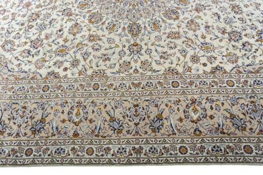 Corner detail of 2000s Kashan rug showing border pattern and Wool pile