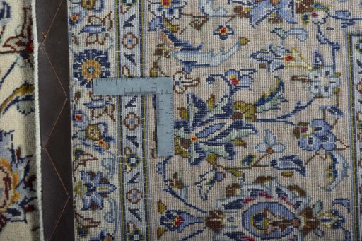 Backside of handmade 2000s Kashan rug showing knot structure and weave density