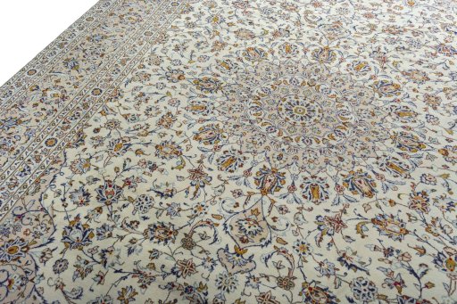 Backside of handmade 2000s Kashan rug showing knot structure and weave density