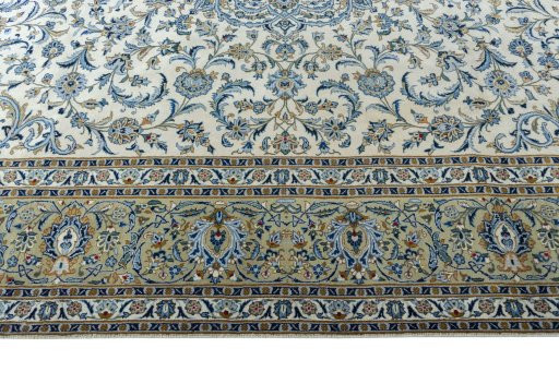 Corner detail of 2000s Kashan rug showing border pattern and Wool pile