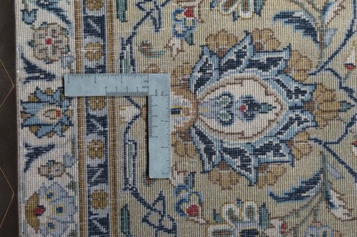 Backside of handmade 2000s Kashan rug showing knot structure and weave density