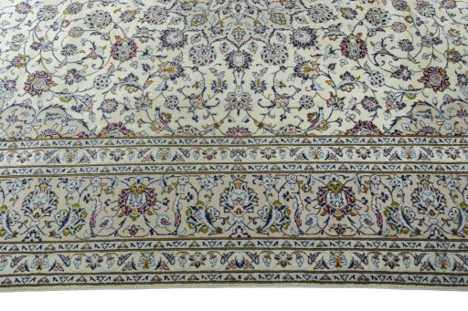 Corner detail of 2000s Kashan rug showing border pattern and Wool pile