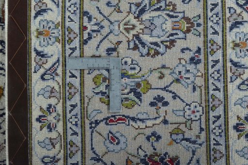 Backside of handmade 2000s Kashan rug showing knot structure and weave density