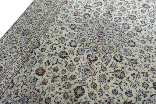 Backside of handmade 2000s Kashan rug showing knot structure and weave density