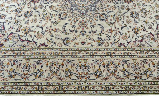 Corner detail of 2000s Kashan rug showing border pattern and Wool pile