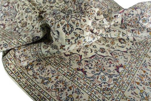 Surface texture of 2000s Kashan rug with natural Wool and intricate pattern