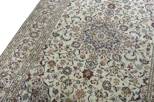 Backside of handmade 2000s Kashan rug showing knot structure and weave density