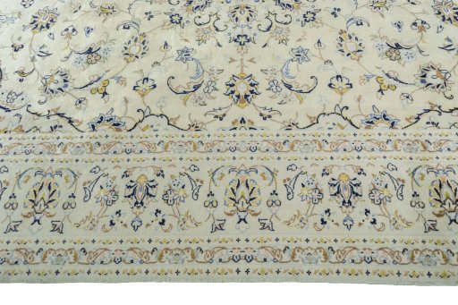 Corner detail of New Kashan rug showing border pattern and Wool pile