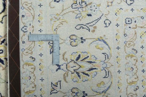 Backside of handmade New Kashan rug showing knot structure and weave density
