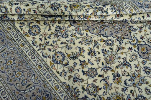 Close-up detail of 2000s Kashan rug from Iran / Persia showing Wool weave