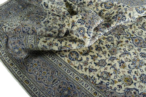 Surface texture of 2000s Kashan rug with natural Wool and intricate pattern