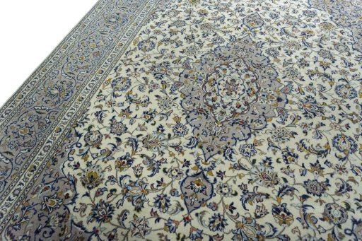 Backside of handmade 2000s Kashan rug showing knot structure and weave density