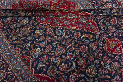 Close-up detail of 2000s Kashan rug from Iran / Persia showing Wool weave