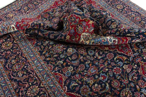 Surface texture of 2000s Kashan rug with natural Wool and intricate pattern