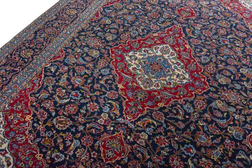 Backside of handmade 2000s Kashan rug showing knot structure and weave density