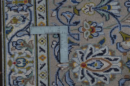 Backside of handmade 2000s Kashan rug showing knot structure and weave density