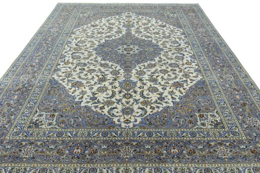 Surface texture of 2000s Kashan rug with natural Wool and intricate pattern