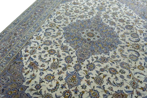 Backside of handmade 2000s Kashan rug showing knot structure and weave density