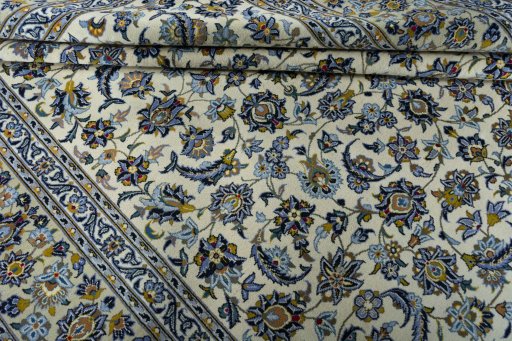 Close-up detail of 2000s Kashan rug from Iran / Persia showing Wool weave