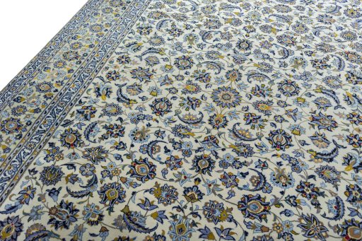 Backside of handmade 2000s Kashan rug showing knot structure and weave density