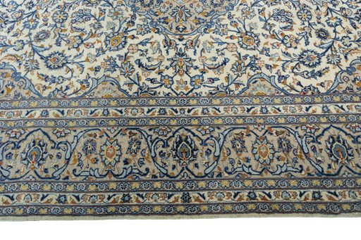 Corner detail of 2000s Kashan rug showing border pattern and Wool pile