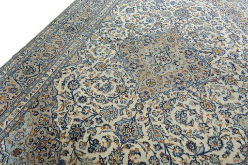 Backside of handmade 2000s Kashan rug showing knot structure and weave density