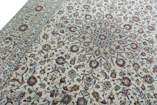 Backside of handmade 2000s Kashan rug showing knot structure and weave density