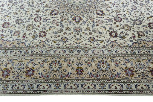 Corner detail of 2000s Kashan rug showing border pattern and Wool pile