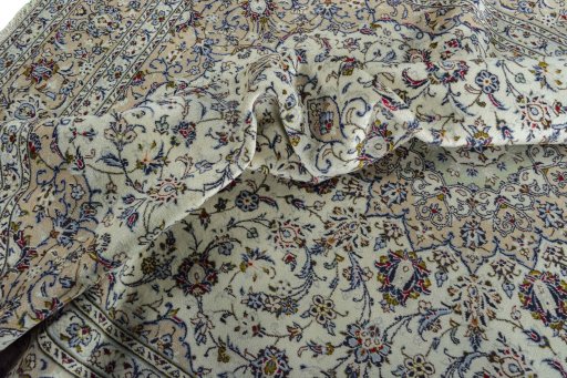 Surface texture of 2000s Kashan rug with natural Wool and intricate pattern