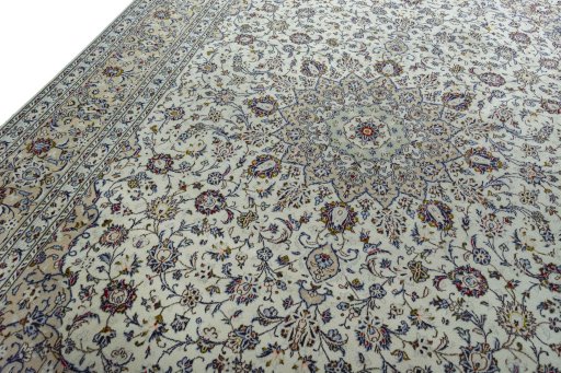 Backside of handmade 2000s Kashan rug showing knot structure and weave density