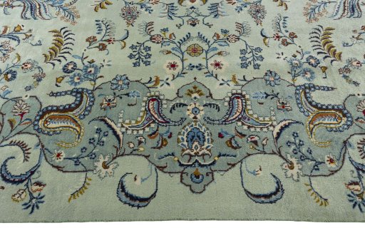 Corner detail of 2000s Kashan rug showing border pattern and Wool pile